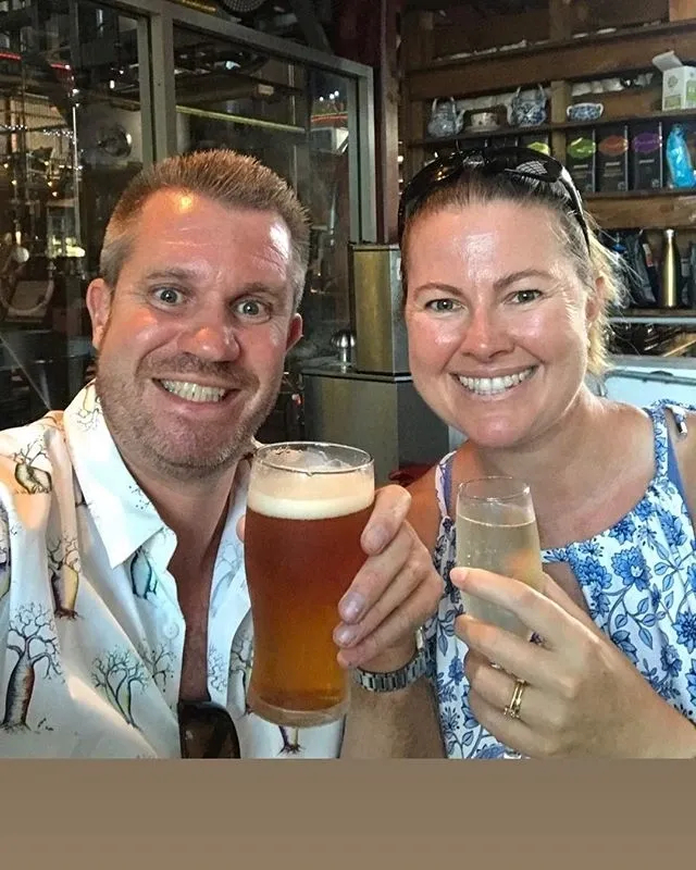 Tim and Jody raising a glass